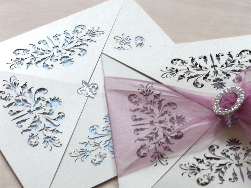 Couture invitations feature a delicate laser cut French pattern - blue