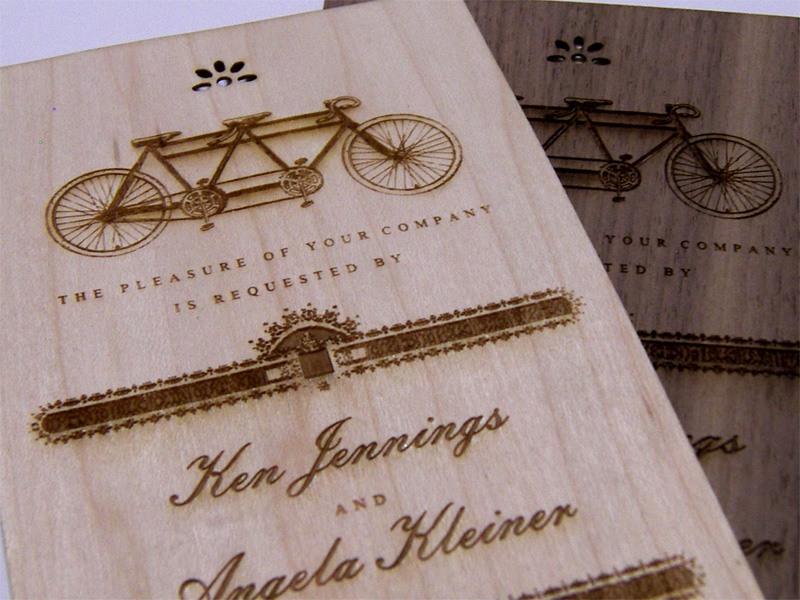 Maple and Walnut laser cut and engraved wedding invitations close up
