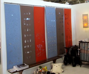 Laser cut merino wool felt window coverings for kids rooms, hanging side by side along with our night lightbox lamp