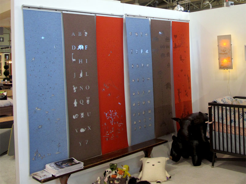 Laser cut merino wool felt window coverings for kids rooms, hanging side by side along with our night lightbox lamp