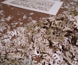 Laser cut outs of letters from wedding invitations