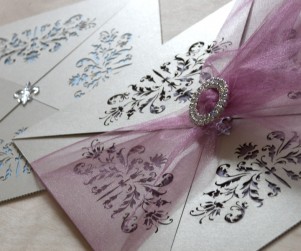 French flair laser cut wedding invitations showing clasp