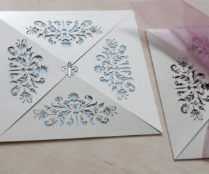 French Flair laser cut wedding invitations showing the pale blue with fleure de lis