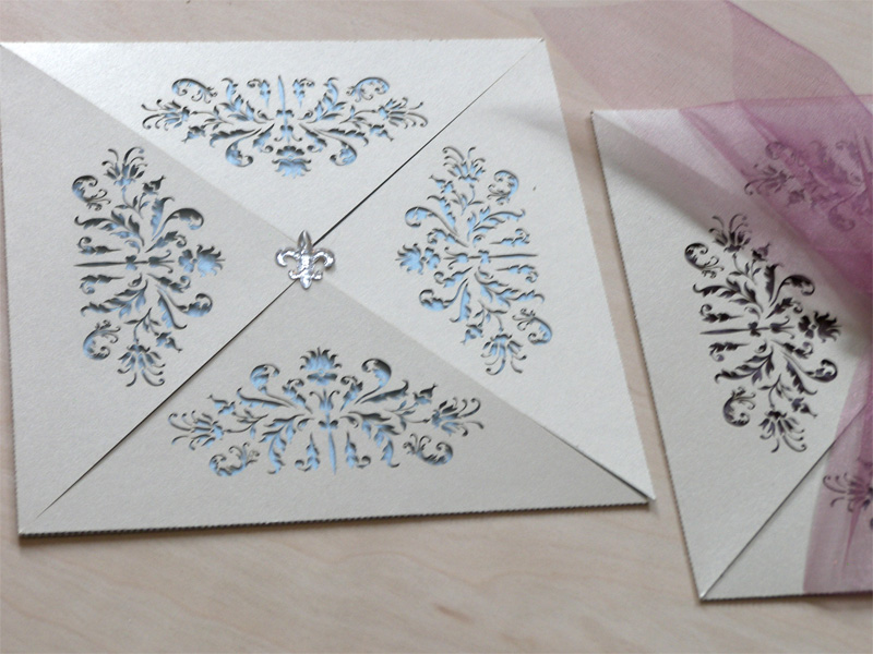 French Flair laser cut wedding invitations showing the pale blue with fleure de lis