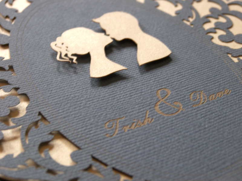 Lovers Cameo laser cut wedding invitations close up of couple in cameo kissing