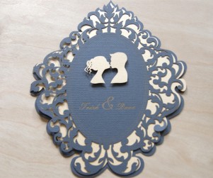 Straight on photograph of Lovers Cameo laser cut wedding invitations