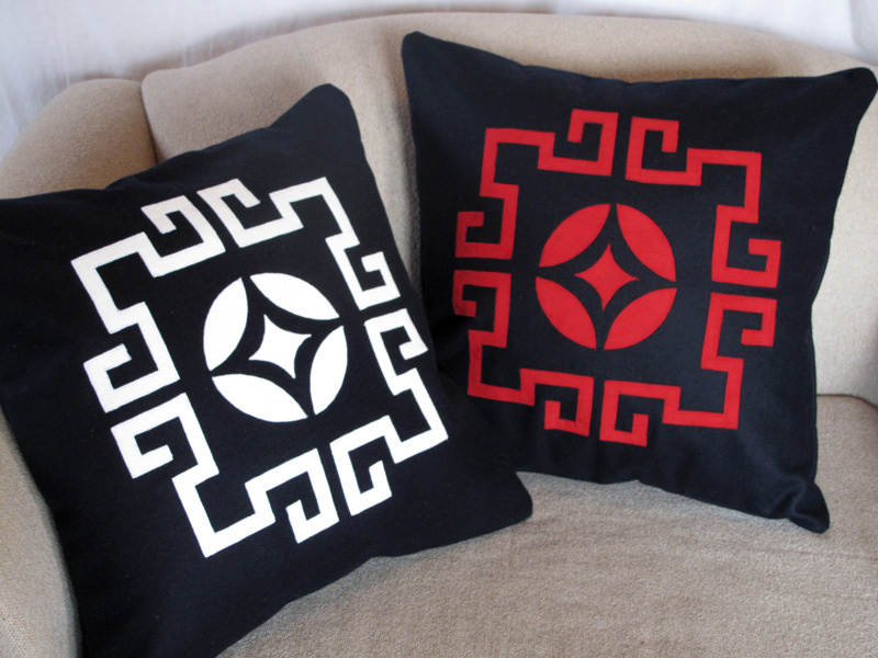 Laser cut throw pillows in white and red