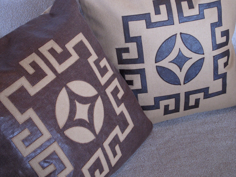Laser cut throw pillows in camel and brown