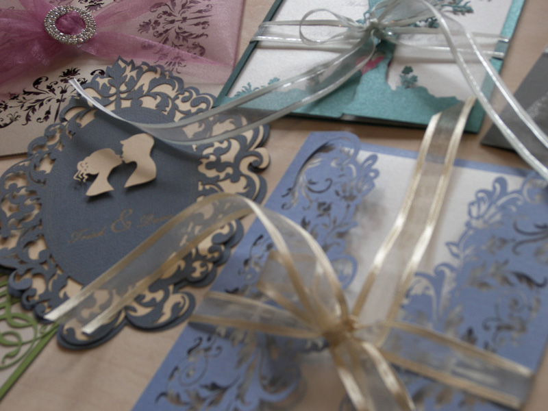 laser cut wedding invitations in different colours and styles