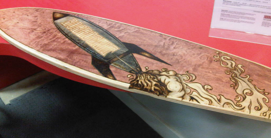 laser cut and laser engraved Roar Rockit wood piece for inlay in longboard / skateboard